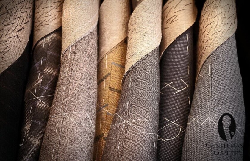 Bespoke Coats in Interesting Fabrics on a rack 