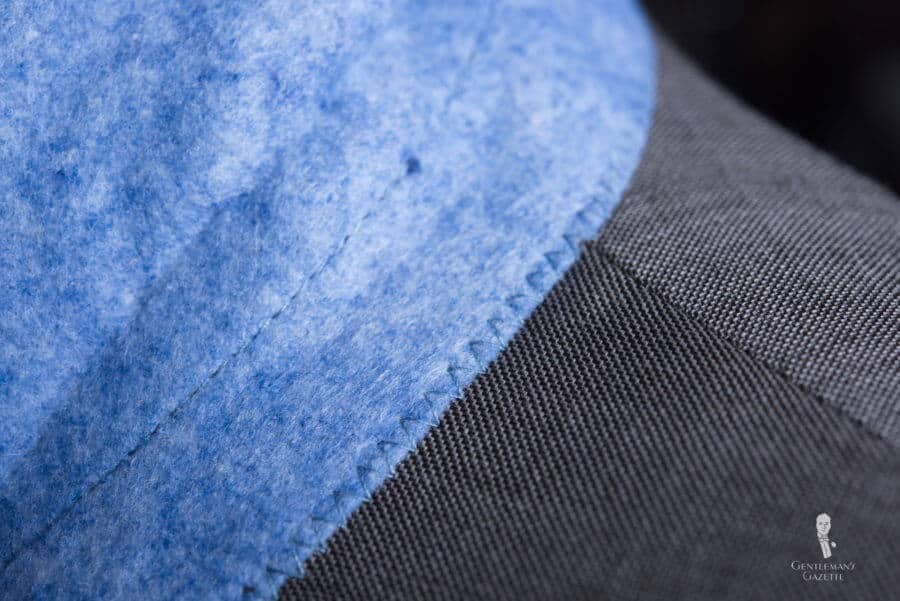 Collar Is Machine Stitched On A 500 Custom Suit Collar is machine stitched on a $500 custom suit