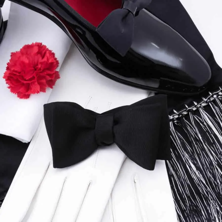 Black Bow Tie in Silk Faille Grosgrain with Red Carnation Boutonniere and Evening Scarf in Black _ White Silk Satin and Black Dress Shoes with White Unlined Leather Gloves