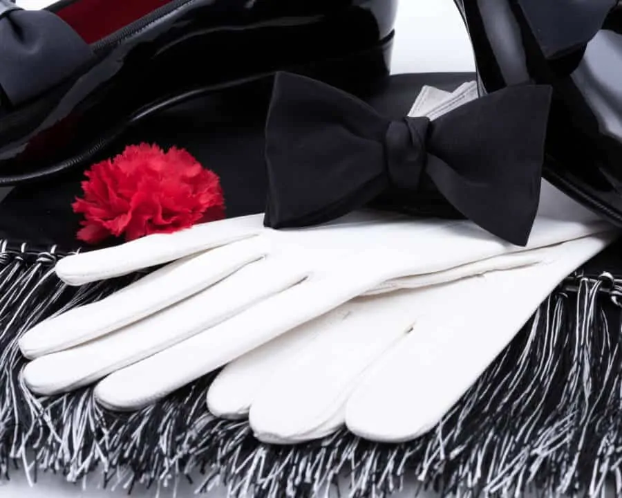 Black Bow Tie in Silk Satin with Red Carnation Boutonniere and Evening Scarf in Black _ White Silk Satin and White Unlined Leather Gloves