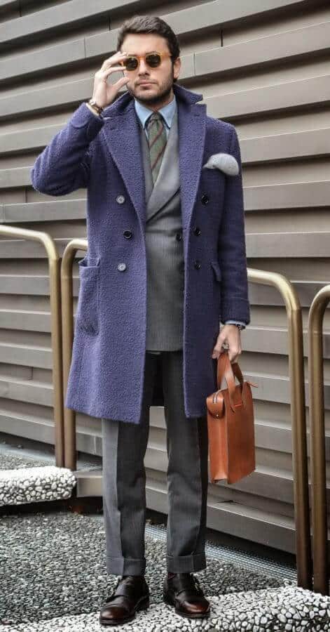 Fabio dapper in a wool DB overcoat in blue with DB sut in grey paired with a single monk shoes