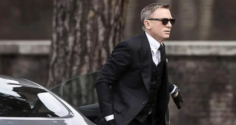 James Bond wearing Wayfarers with a suit
