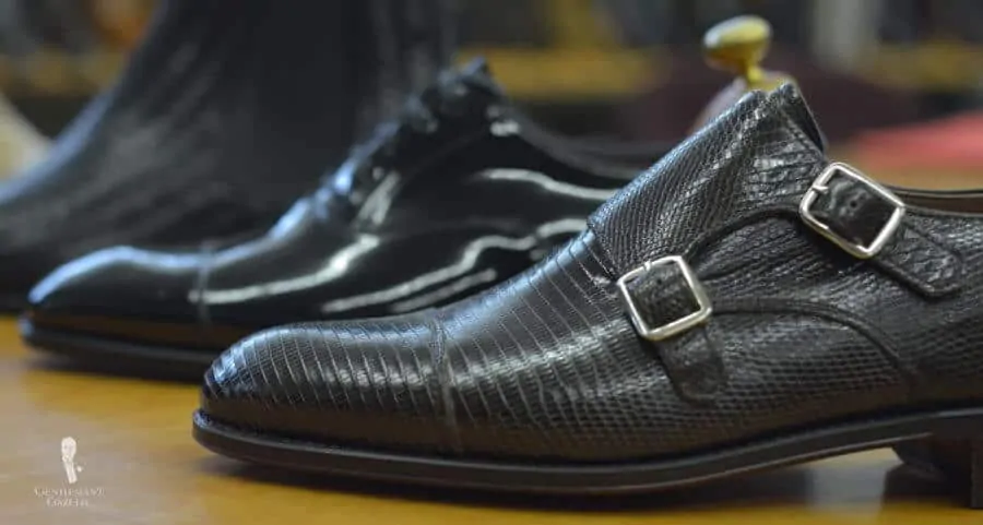 Lizard skin captoe double monk strap shoe in black with silver buckles