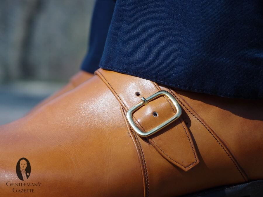 Gold buckles on a tan monk strap shoe