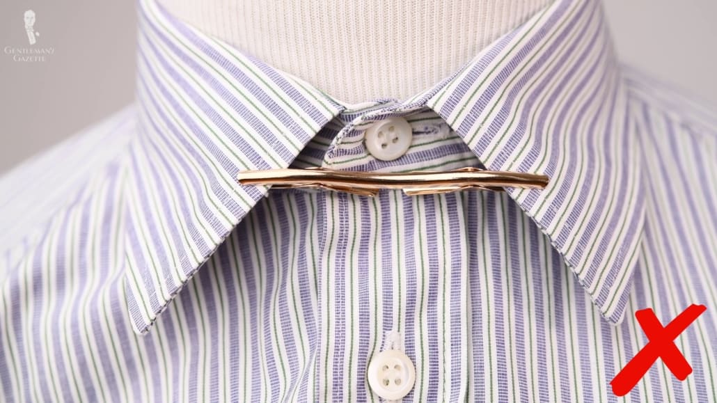 Wearing a collar clip without neckwear isn't a look we would recommend.