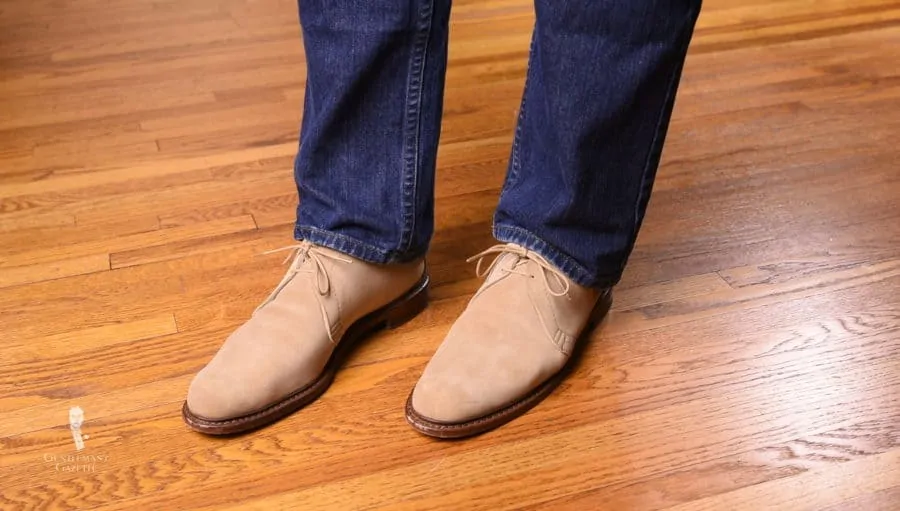 Allen Edmonds Chukka boots paired with dark denim jeans
