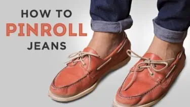 Pinrolled denim jeans paired with orange loafers