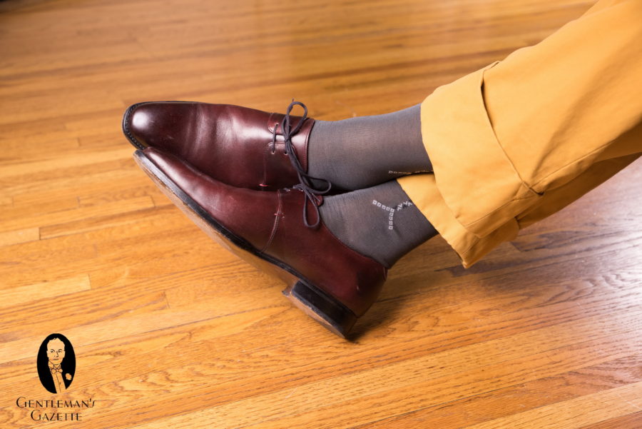 Oxblood derby shoes with Grey Socks with Light Grey and Black Clocks in Cotton - Fort Belvedere with mustard yellow trousers