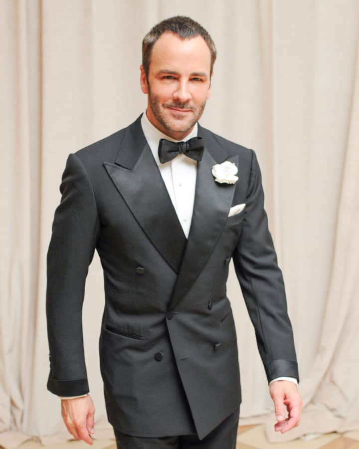 Tom Ford in a nicely cut 6x4 Tuxedo with wide peaked lapels, cloth covered buttons, satin turnback cuffs and jetted pockets