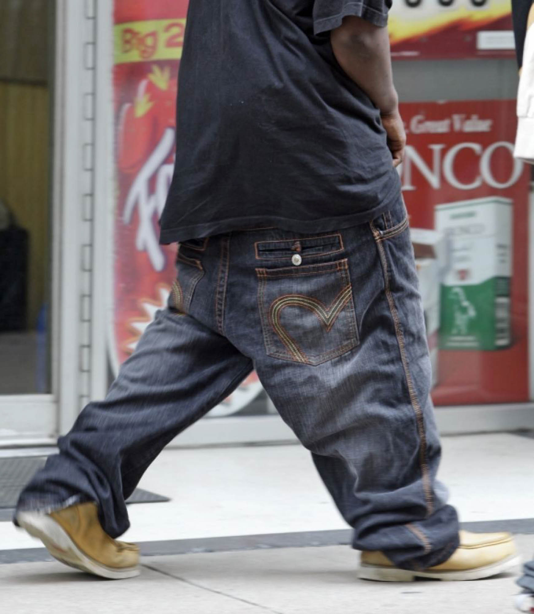 An older man wearing baggy and sagging jeans