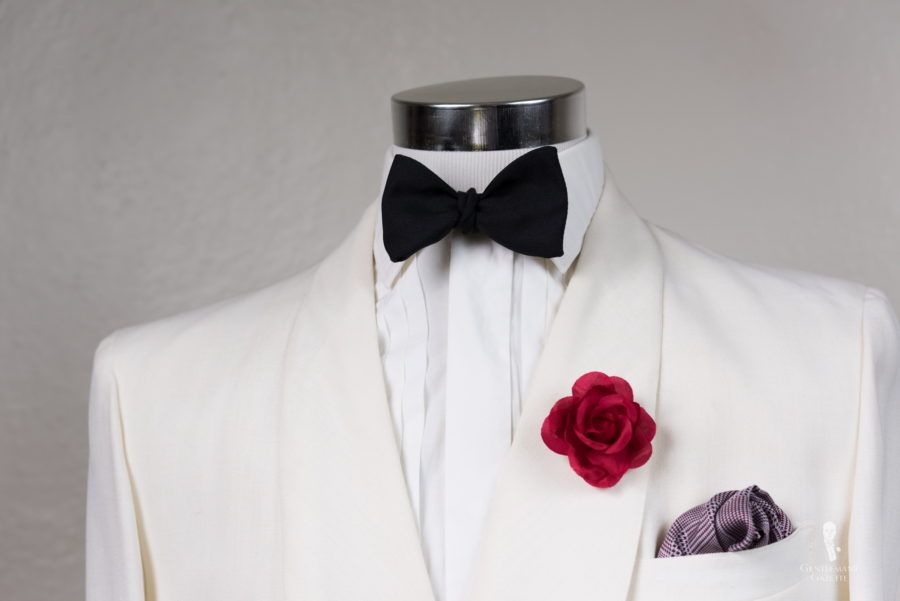 Off-white Dinner jacket with Fort Belvedere red spray rose boutonniere and Black Bow Tie in Silk Barathea and Burgundy glen plaid silk pocket square