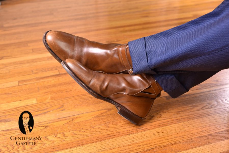 brown jodhpur boots with navy blue trousers