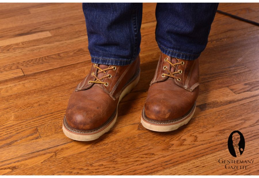 Brown work boots with denim jeans