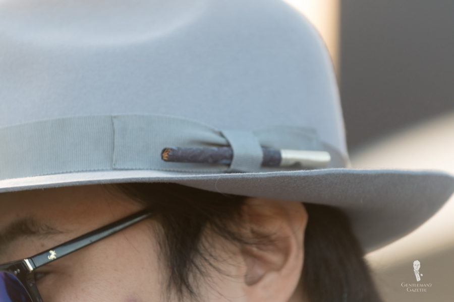 Hat band with a cigarette