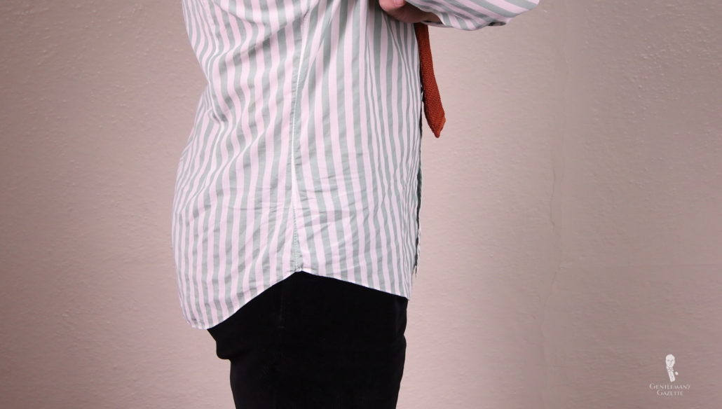 Dress shirts are traditionally longer in the back and in the front but shorter on the sides