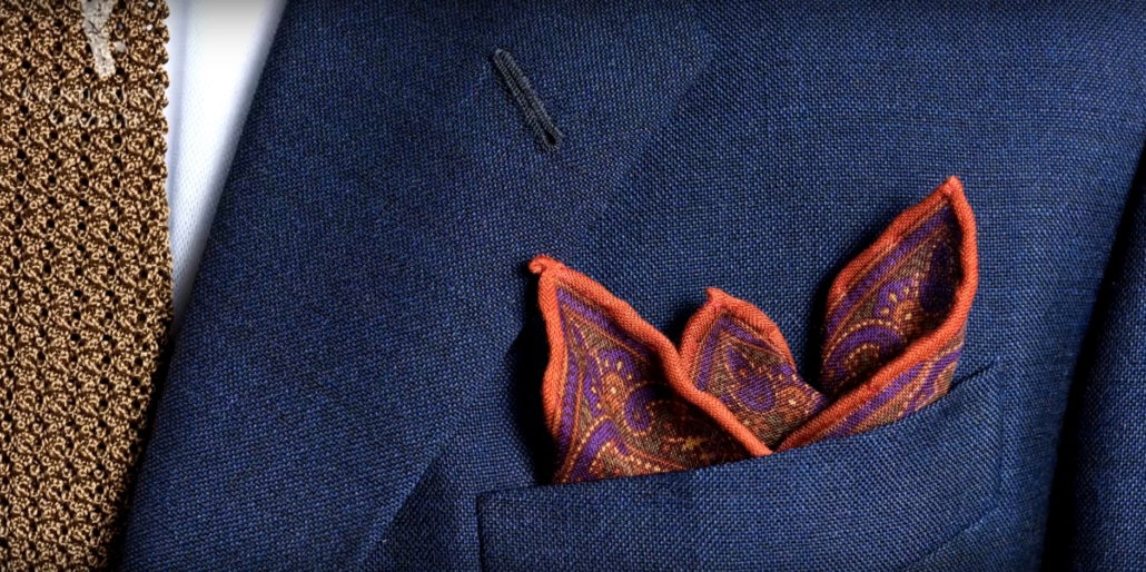 Hand rolled edges Burnt Orange Silk-Wool Pocket Square with Paisley Motifs and tobacco brown knit tie - Fort Belvedere