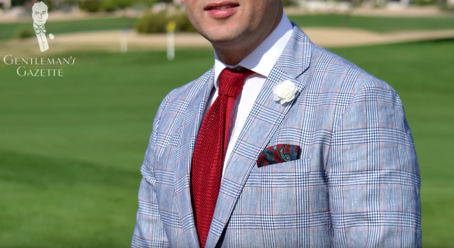 Raphael wearing a Gagliardi Glen check Summer Sportcoat with Knit Tie in Solid Red Silk, White Spray Rose Boutonniere and Pocket Square from Fort Belvedere