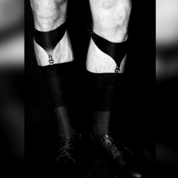 A photo of a man wearing Sock Garters