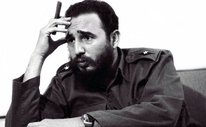 Fidel Castro with his country's signature product and his Rolex GMT Master 