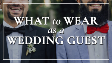A close-up image of two men, one in a tuxedo jacket, white shirt, black bow tie, and boutonniere, the other in a light blue jacket, white shirt, and red bow tie; text reads, "What to Wear as a Wedding Guest"