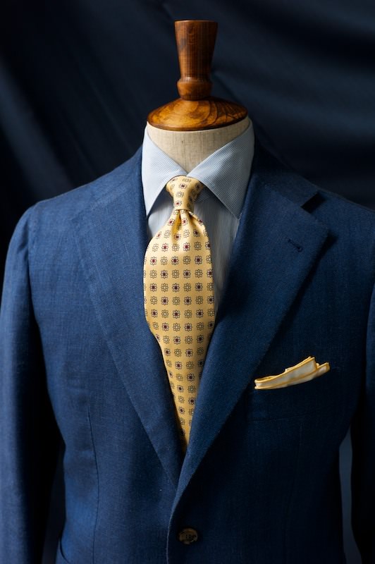 Drakes Buttermilk Tie and a Simmonot Godard shoestring edge pocket square worn with blue for summer.