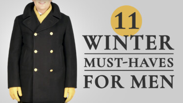 Raphael stands in a navy peacoat with gold buttons, with yellow gloves and scarf from Fort Belvedere; text reads, "11 Winter Must-Haves for Men"