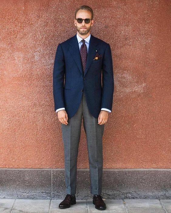 Andreas Weinås doesn't look like a security guard in this combination of navy and gray.