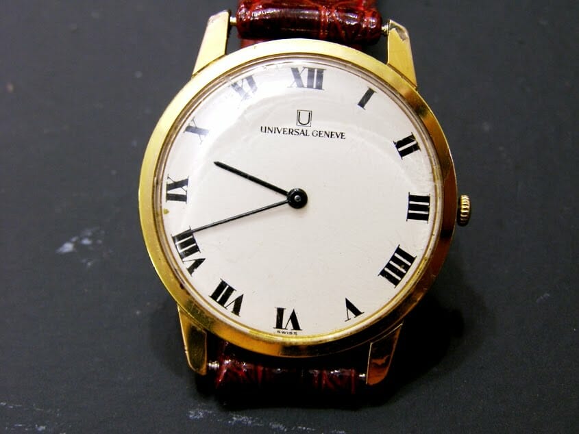  A gold-cased Universal Genève watch