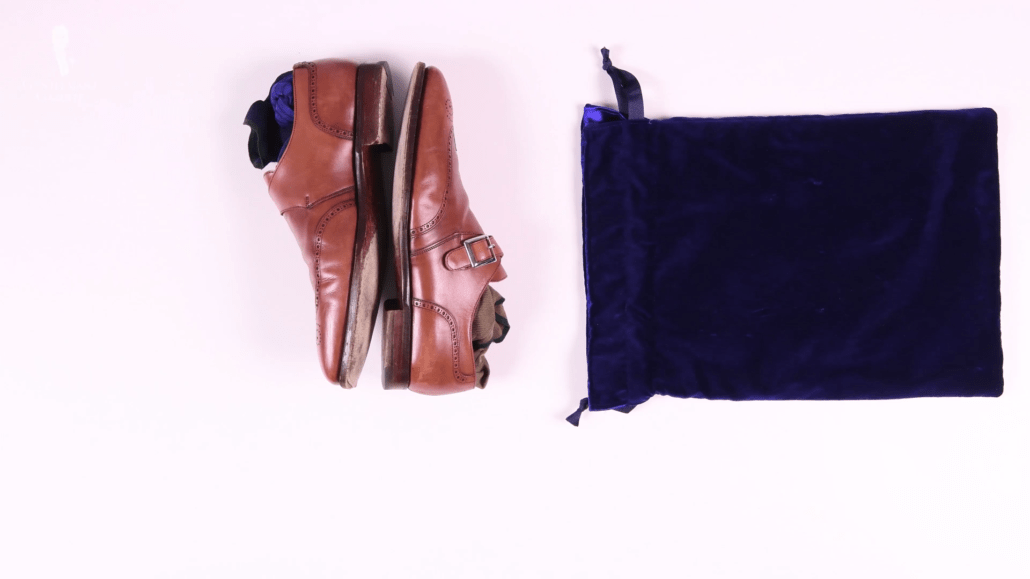 Brown shoes and a shoe bag