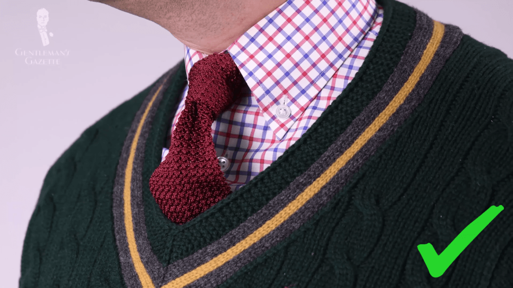 Green V-neck knit sweater with plaid dress shirt and burgundy knit tie by Fort Belvedere