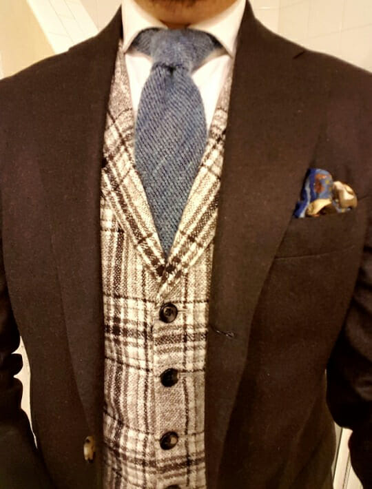 The author wearing a waistcoat with a brown plaid pattern to match a brown flannel suit.