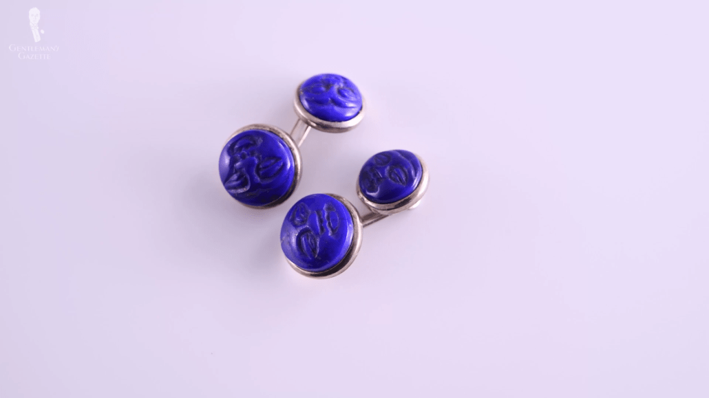 Carved lapislazuli faces mounted on double sided sterling silver cufflinks