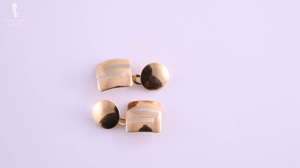 Lightweight gold double sided cufflinks with an S shape on a square