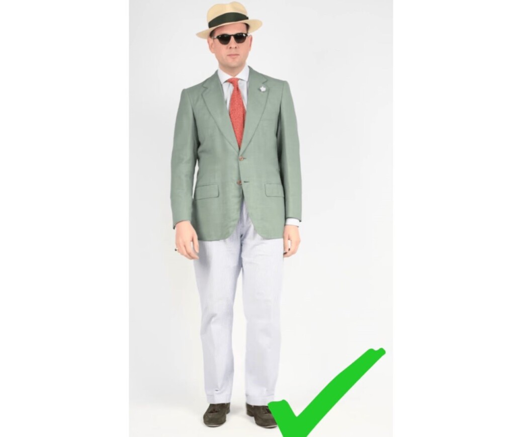 Raphael in green linen sports coat and pants paired with a panama hat