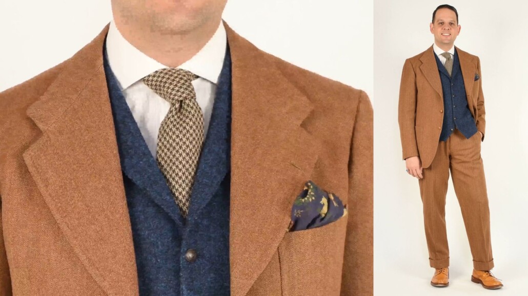 A classic brown two-piece single breasted suit paired with a blue tweed vest.