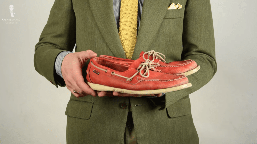 Red Sebago boat shoes with white soles and leather laces