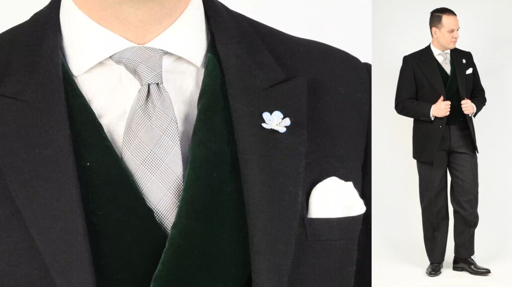 Sven wearing a dark charcoal morning coat with peak lapel, green velvet double breasted vest, white dress shirt with Fort Belvedere accessories