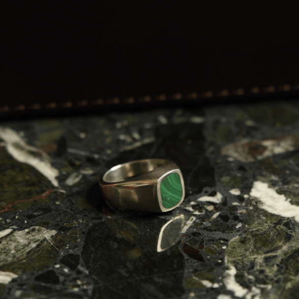 A silver malachite ring