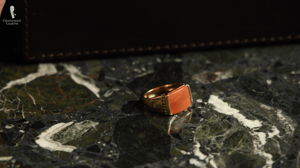 Ring with an unidentified orange stone