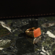 Ring with an unidentified orange stone