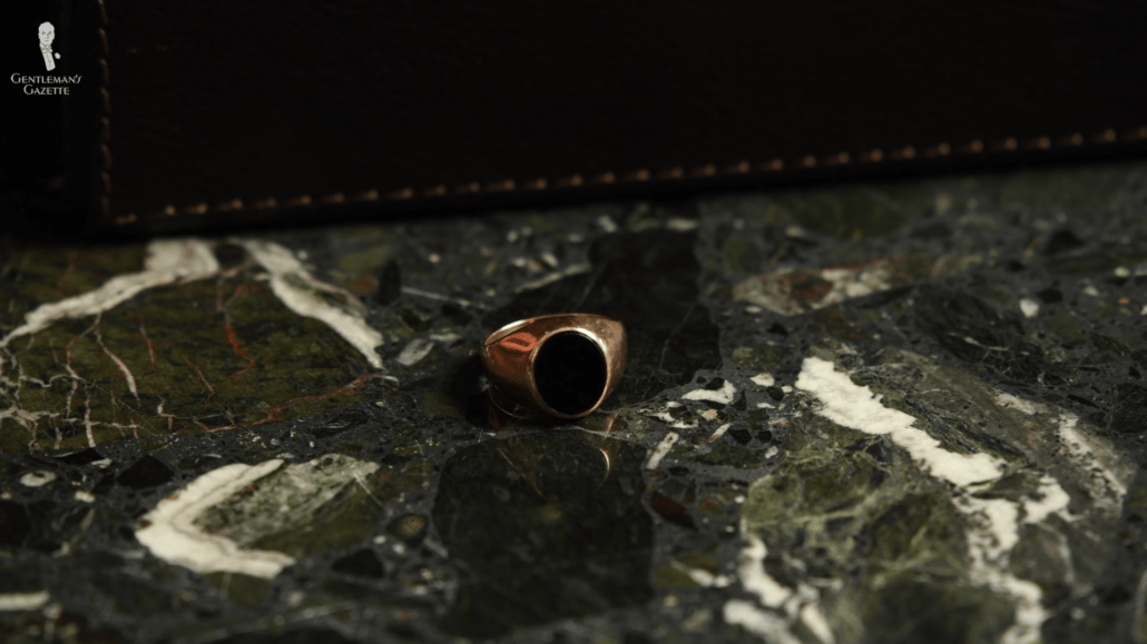 14 karat rose gold ring with an oval Onyx