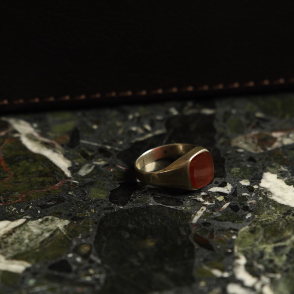 A small gold ring with a carnelian stone