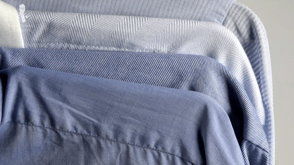 A selection of light blue dress shirts in different shades