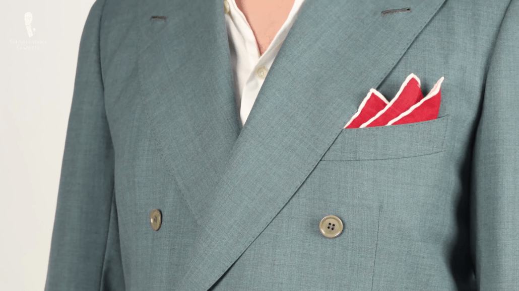 Bright red pocket square with white contrasting edges