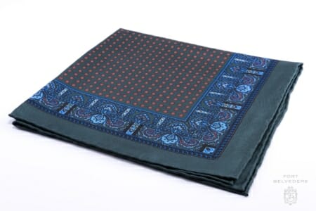 Pair this dark green silk pocket square from Fort Belvedere with blue tailoring for summer