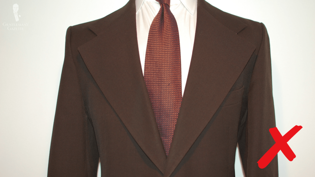 Dark brown suit jacket with wide lapel