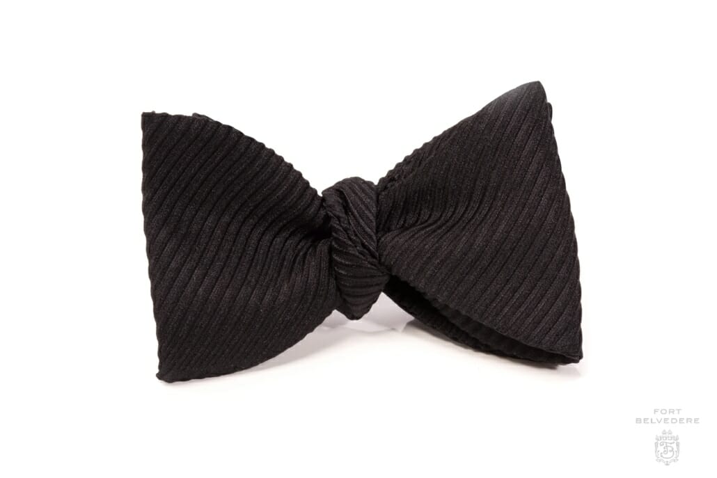 White bow tie with distinctive black and white Zebra motifs.