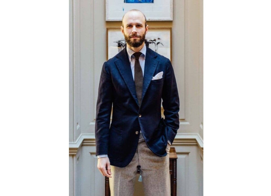 Office outfit with tobacco brown knit tie and navy blazer