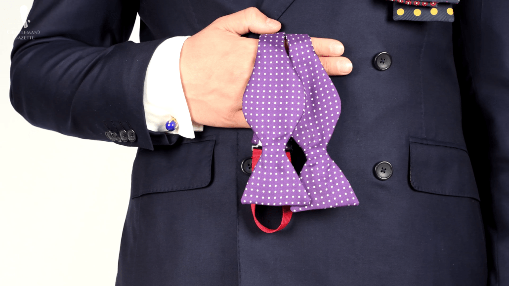 Purple bow tie with white spots