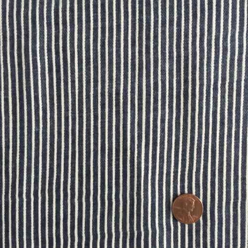 Railroad stripe fabric, with penny included to show the size of the weave.